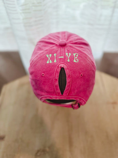 Hot Pink Dad Hat With Xi-Ye Branding and Ponytail space. 