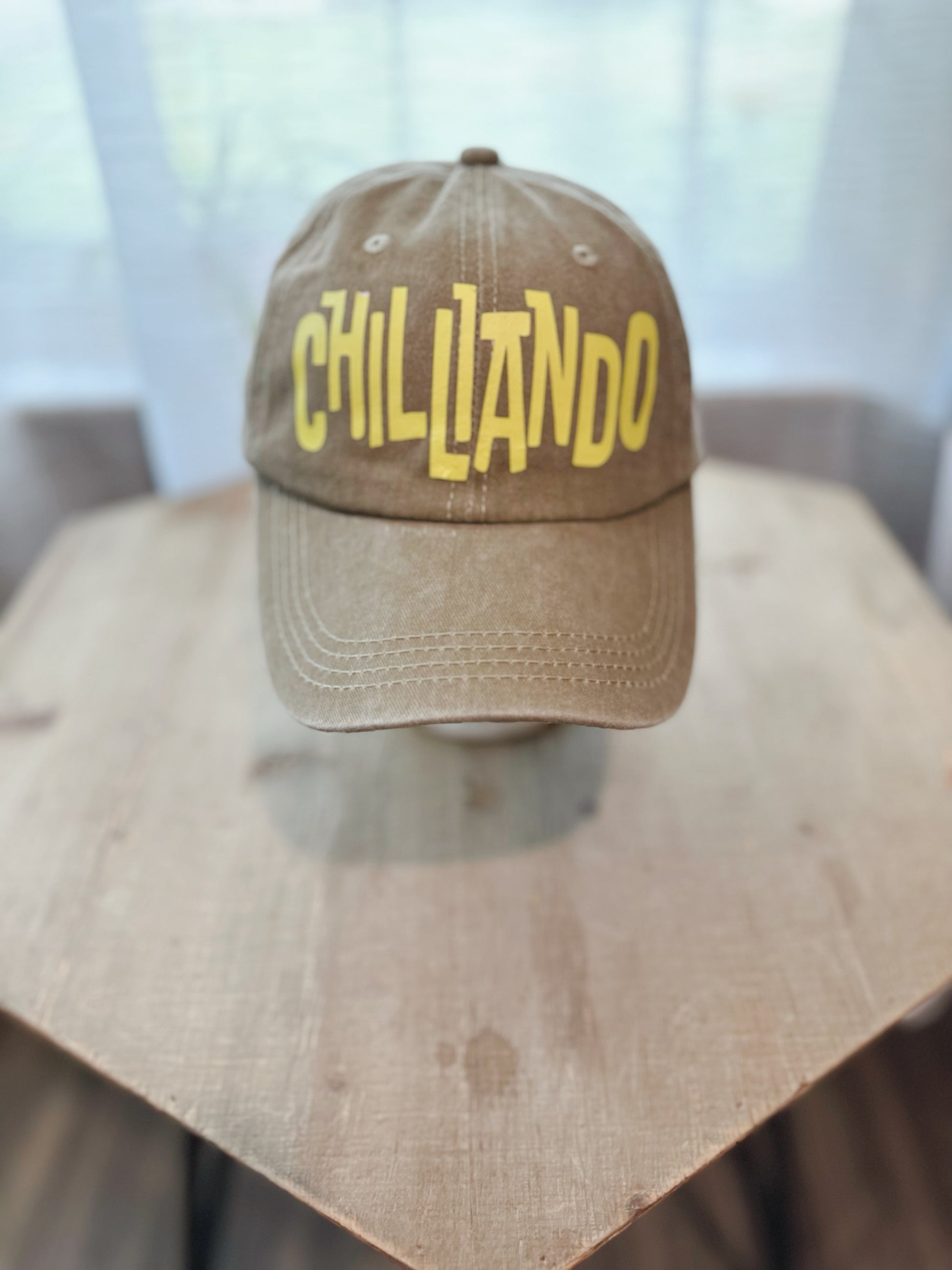 Tan Denim Dad Hat With Yellow Lettering Saying " Cilliando". 